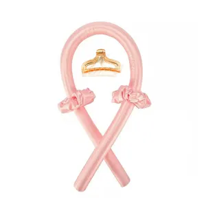 Detail view of the satin heatless hair curler set showing the soft pink curling rod and accessories.