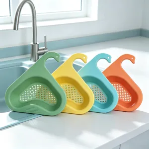 Swan kitchen sink drain basket detail view, hanging plastic strainer mesh for washing vegetables.