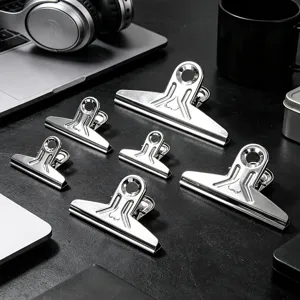 Stainless steel binder clips detail view, strong metal clamps for office and sketching organisation.