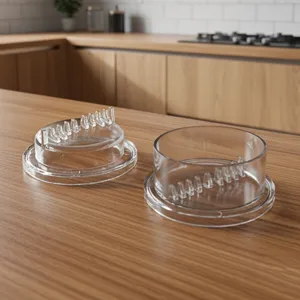 Clear plastic garlic press detail view, showing the inner teeth structure for kitchen food prep.