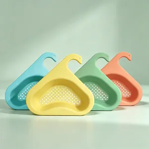 Close-up detail of swan sink drain basket with multi-color options for kitchen use.
