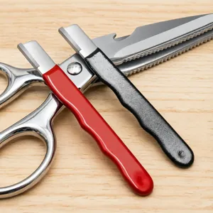 Portable kitchen knife sharpener tool set with red and black handles for garden pruning shears.