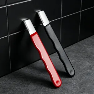 Portable manual knife sharpener with ergonomic handle for kitchen and garden tools.