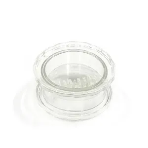 Clear plastic manual garlic press twist mincer kitchen tool for easy garlic grinding.