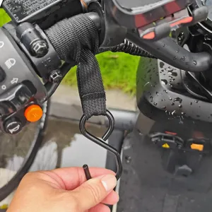 Detail view of universal motorcycle handlebar hook, strong strap and metal S-hook.