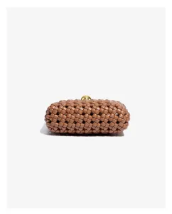 Detailed shot of brown woven leather clutch with a chic gold spherical clasp closure.