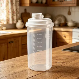 Clear plastic kitchen storage container with scale and lid, ideal for flour or sugar.