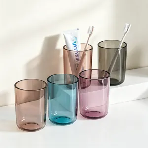 Transparent plastic mouthwash cups set, colorful toothbrush holder for bathroom home use.