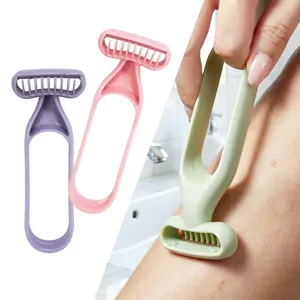 Manual hair removal razor with ring handle and comb teeth for smooth body leg shaving.