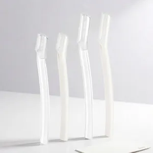 Detail view of white safety eyebrow razor, precise hair removal tool for daily facial use.