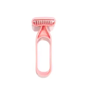 Pink manual razor detail shot, plastic loop handle hair removal tool for women body grooming.
