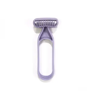 Detail view of a purple manual hair removal shaver for smooth and safe body hair trimming.