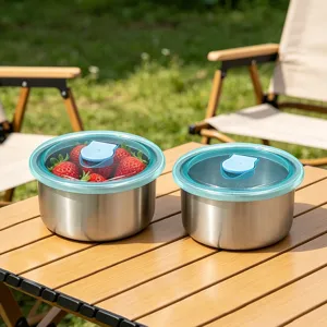 Boite de conservation ronde en acier inoxydable avec couvercle etanche, ideale pour le pique-nique.