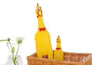 Detailed view of yellow rubber screaming chicken squeaky pet toys inside a woven basket.