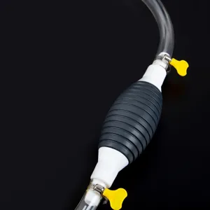 Manual fuel transfer pump detail shot, highlighting the squeeze bulb and transparent hose.