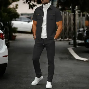 Detailed view of men waffle knit short sleeve jacket and trousers set in outdoor scene.