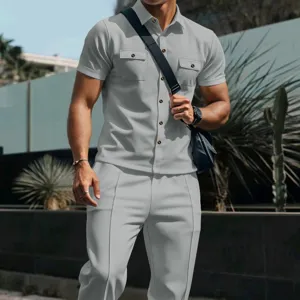 Close-up view of men's casual waffle texture short sleeve shirt and trousers outfit details.