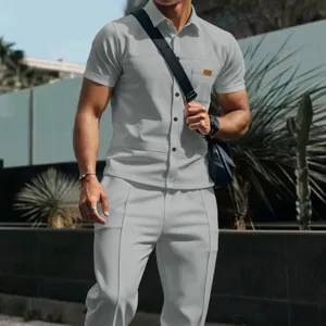 Men gray waffle knit short sleeve shirt and long trousers set detail view outdoor casual outfit