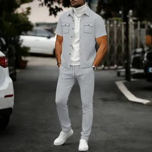 Detail shot of the men's casual waffle short sleeve button up shirt and matching pants set in outdoor setting.