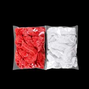 Einweg-Tischdecken aus Plastik mit elastischen Bändern, rote und weiße Detailansicht.