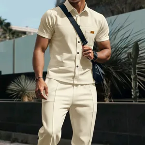 Detailed view of mens casual waffle knit short sleeve shirt and trousers clothing set outfit.