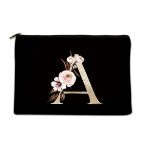 Trousse de toilette en toile noire avec lettre A dorée et fleurs pour le voyage
