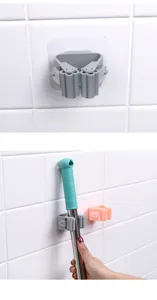 Detailansicht des lochfreien, wandmontierten Mopp- und Besenhalters mit Silikonrolle.