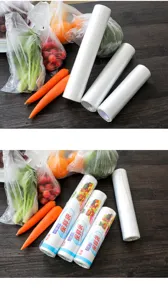 Detail view of disposable food storage bags on wooden table, transparent continuous roll.