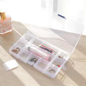 Clear plastic jewelry storage box with lid, multi-grid portable organizer for earrings.