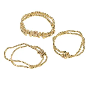 Gold plated beaded stretch bracelets set featuring cute letter charms including MOM initials.