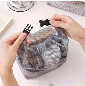 Waterproof mesh travel toiletry bag detail showing secure plastic buckle and dry wet design.