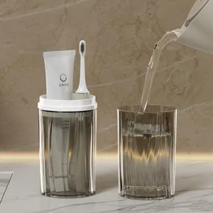 Portable travel mouthwash cup toothbrush holder set with toothpaste and glass for outdoor trips.