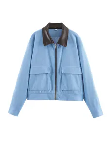 Women light blue corduroy jacket with contrast brown leather lapel and chest pockets.