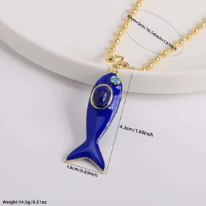Detail shot of the 18K gold plated enamel fish pendant necklace, showcasing exquisite craftsmanship.