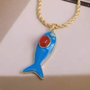 Gold-plated enamel blue fish pendant necklace with red stone and zircon details for women.