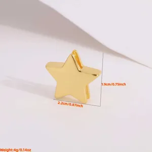 Golden metal star shape jewelry component detail view, smooth surface pendant connector.