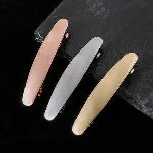Metal hair clip detail shot, brushed finish barrette in assorted metallic colors for daily styling.