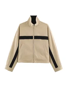 Close-up detail of the high collar, front zipper and black contrast stripe on the stylish jacket.