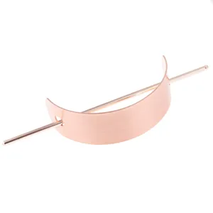 Detailed close-up of rose gold metal hair fork, elegant crescent bun cage hairpin accessory.