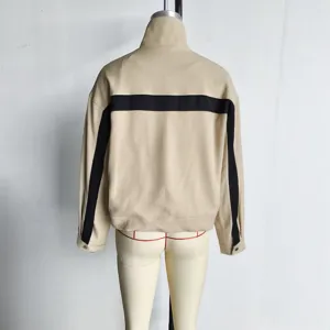 Detailed back view of a beige color block high collar casual zipper jacket for women.