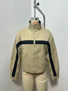 Detailed view of the stylish stand-collar contrast zipper jacket in beige with black stripes.