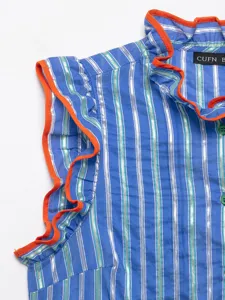 Close-up detail of blue silver striped sleeveless women blouse featuring vibrant orange ruffles.