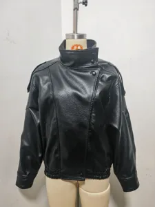 Black faux leather jacket detail, featuring unique double collar and stylish texture.