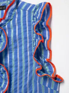 Detail shot of blue striped sleeveless blouse with vibrant orange ruffled trim and texture.