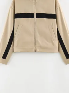 Women's casual stand collar color block zip up jacket with sporty stripes and practical pockets.