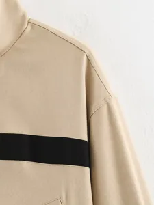 Khaki color-blocked stand collar jacket detail, casual long sleeve outerwear fashion.
