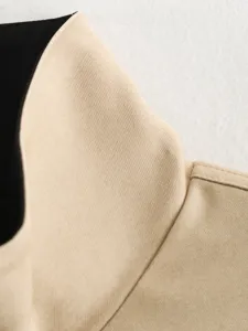 Khaki twill fabric stand collar detail shot, showing smooth texture and contrast black lining.
