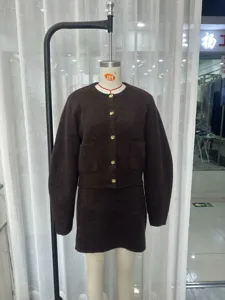 Dark brown knitted two-piece set featuring a round neck cardigan and high-waisted mini skirt.