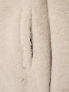 Women's faux fur long coat fabric detail view, soft plush texture and pocket seam craft.