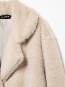 Detailed view of a beige faux fur lapel coat, showcasing soft texture and elegant design style.